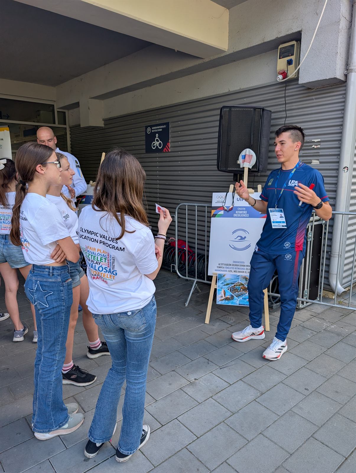 Temirkhan Sabdenbek speaking to young athletes at the Olympic Values Education Program